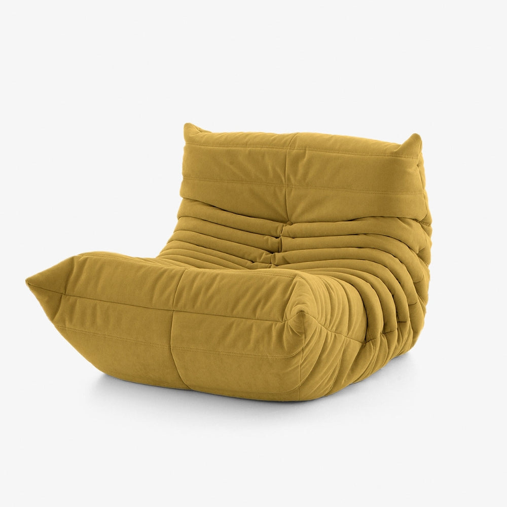 #Jaune Koto Mini chauffeuse lounge compressée 1 place coloris jaune, vue de profil : fauteuil bas au design 70s, assise ferme, velours matelassé, livré compressé