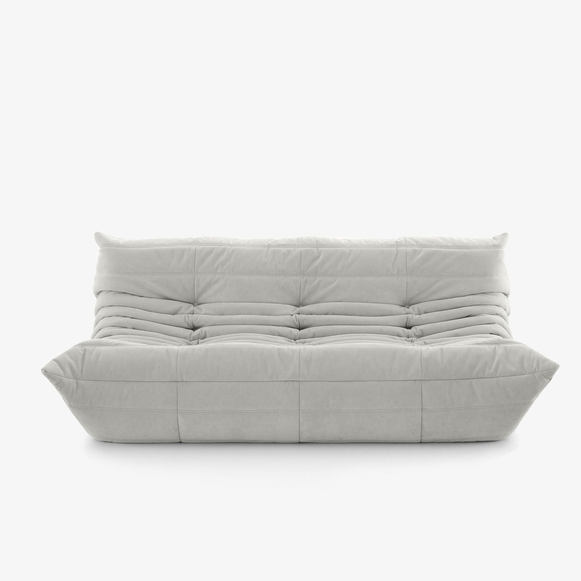 #Blanc Koto canapé lounge compressé 3 places coloris blanc, vue trois quarts : assise ferme, silhouette années 70, velours matelassé, livré compressé dans un seul carton