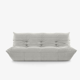 #Blanc Koto canapé lounge compressé 3 places coloris blanc, vue trois quarts : assise ferme, silhouette années 70, velours matelassé, livré compressé dans un seul carton