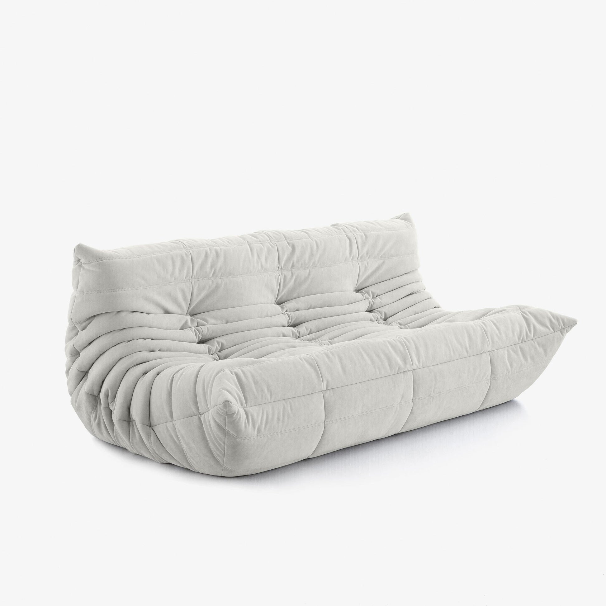 #Blanc Koto canapé lounge compressé 3 places coloris blanc, vue de profil : assise ferme, silhouette années 70, velours matelassé, livré compressé dans un seul carton