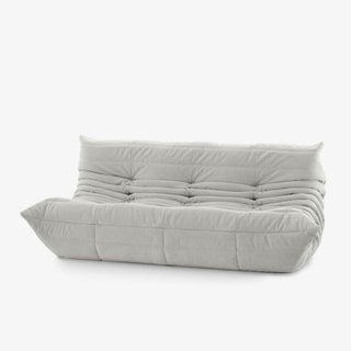 #Blanc Koto canapé lounge compressé 3 places coloris blanc, détail du matelassage et des coutures : assise ferme, silhouette années 70, velours matelassé, livré compressé dans un seul carton