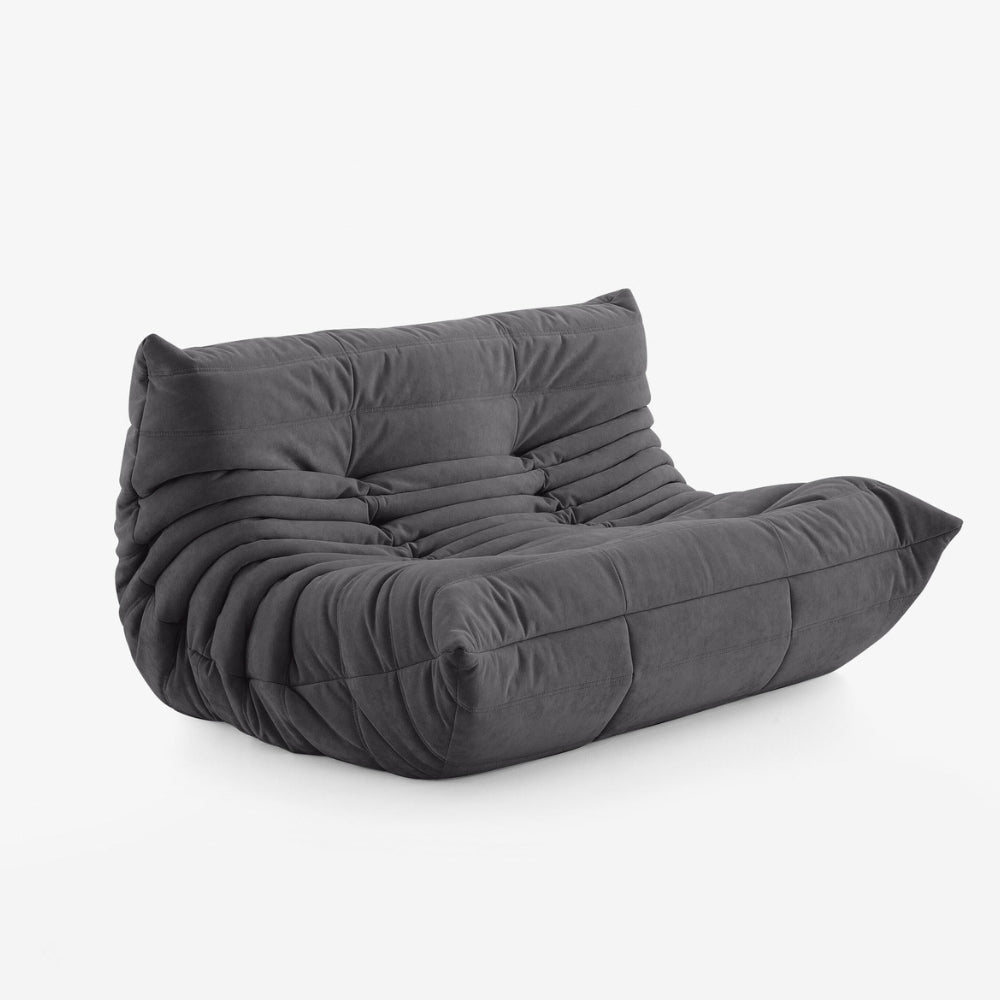 #Noir Koto Classic canapé lounge compressé 2 places coloris noir, vue de profil : assise ferme, ligne années 70, velours matelassé, livré compressé dans un seul carton