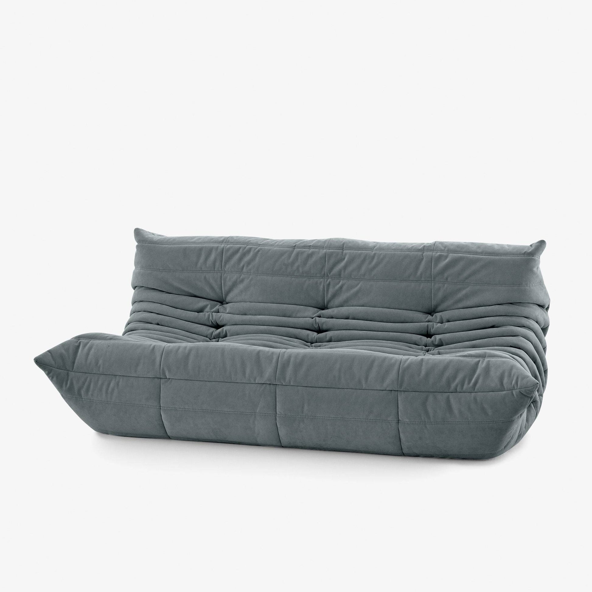 #Gris Koto canapé lounge compressé 3 places coloris gris, détail du matelassage et des coutures : assise ferme, silhouette années 70, velours matelassé, livré compressé dans un seul carton