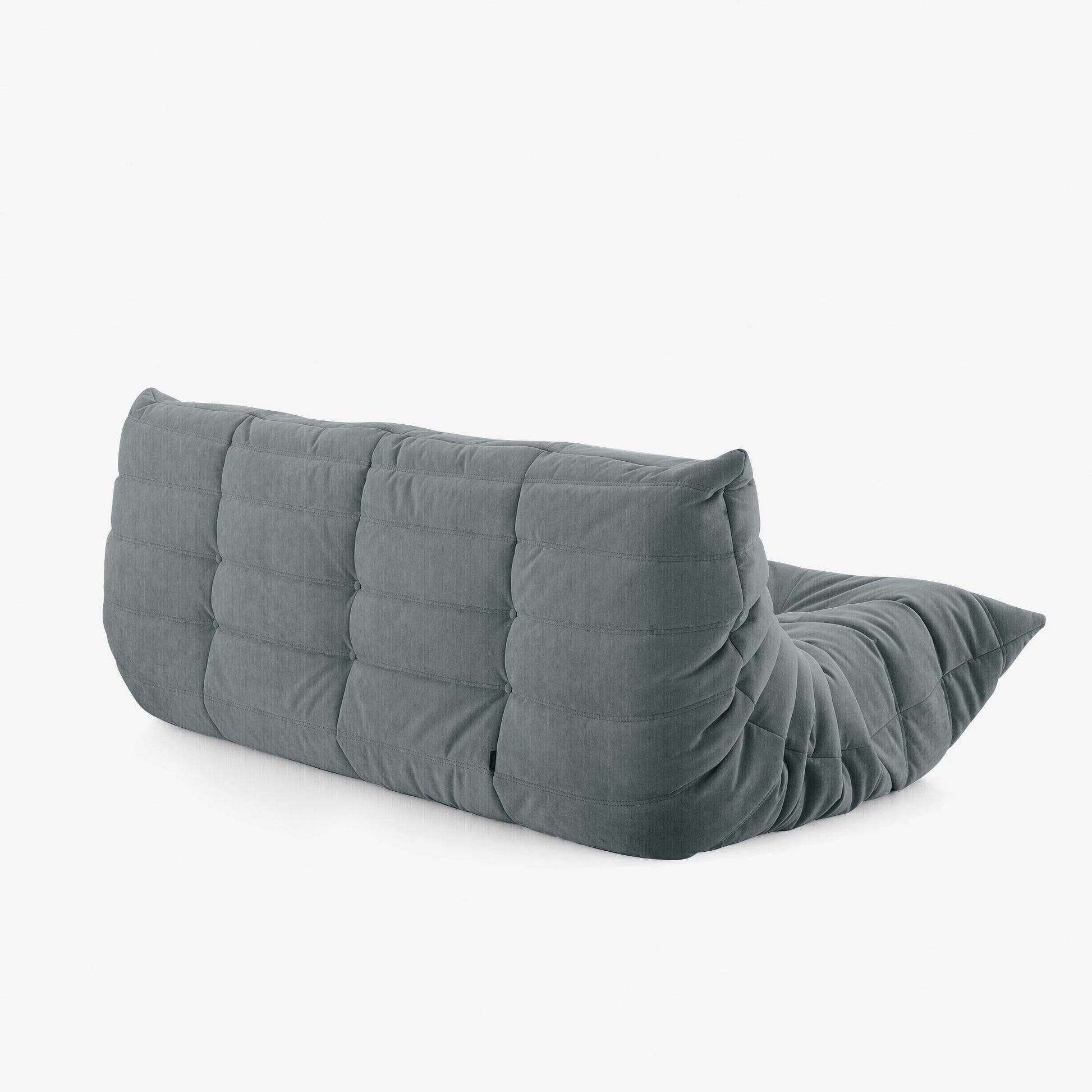 #Gris Koto canapé lounge compressé 3 places coloris gris, mise en situation dans un salon : assise ferme, silhouette années 70, velours matelassé, livré compressé dans un seul carton