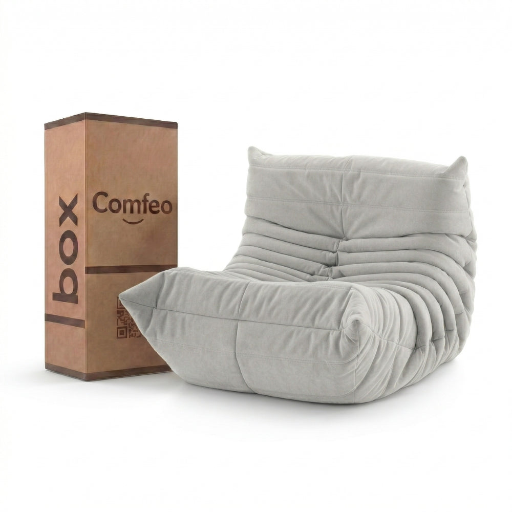 #Blanc Koto Mini chauffeuse lounge compressée 1 place coloris blanc, vue de face : fauteuil bas au design 70s, assise ferme, velours matelassé, livré compressé