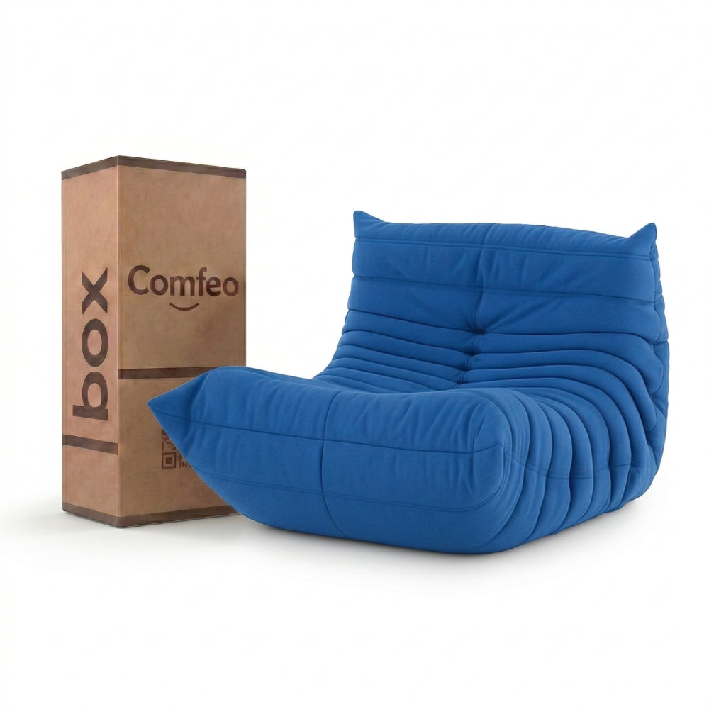 #Bleu Koto Mini chauffeuse lounge compressée 1 place coloris bleu, vue de face : fauteuil bas au design 70s, assise ferme, velours matelassé, livré compressé