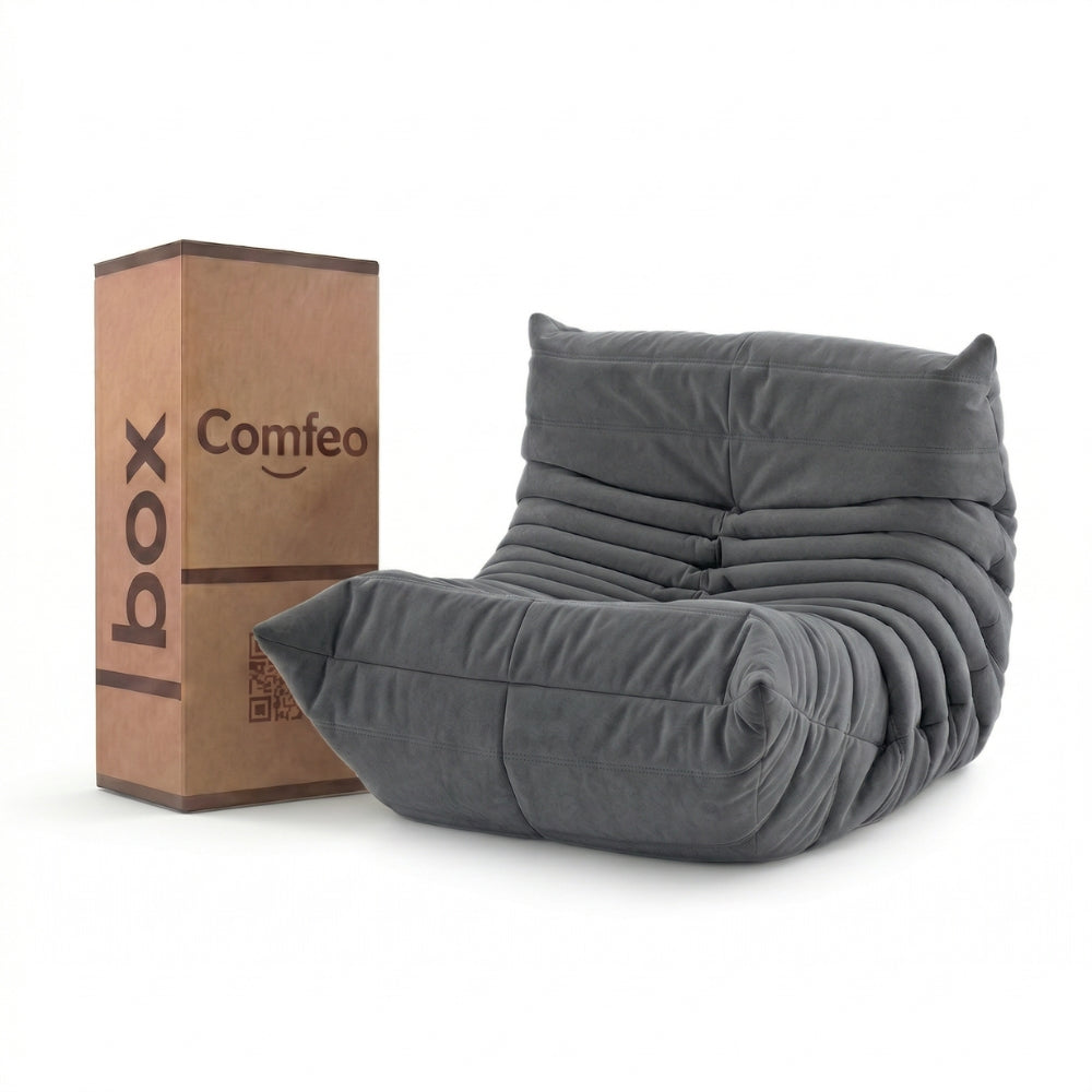 #Gris Koto Mini chauffeuse lounge compressée 1 place coloris gris, vue de face : fauteuil bas au design 70s, assise ferme, velours matelassé, livré compressé