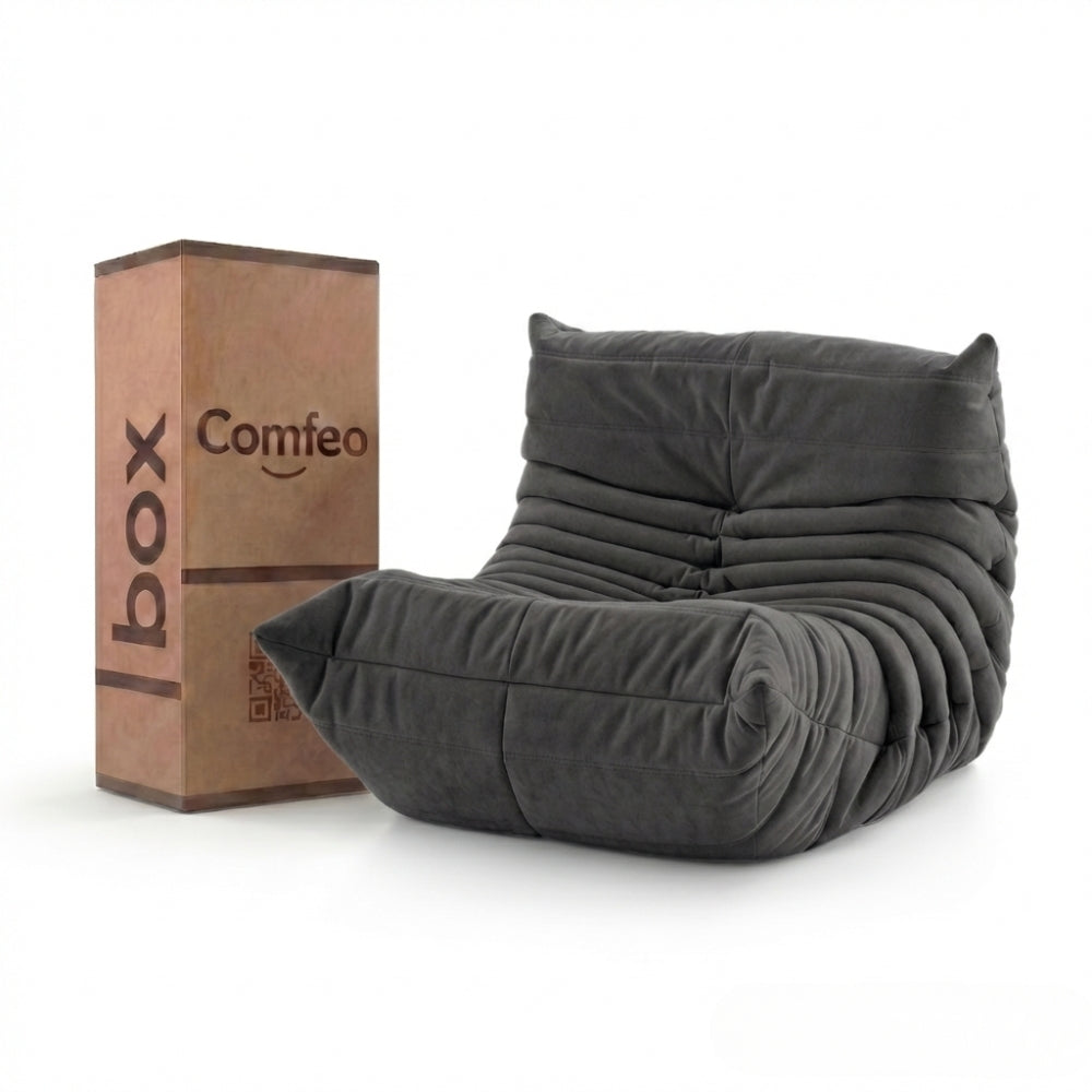#Noir Koto Mini chauffeuse lounge compressée 1 place coloris noir, vue de face : fauteuil bas au design 70s, assise ferme, velours matelassé, livré compressé