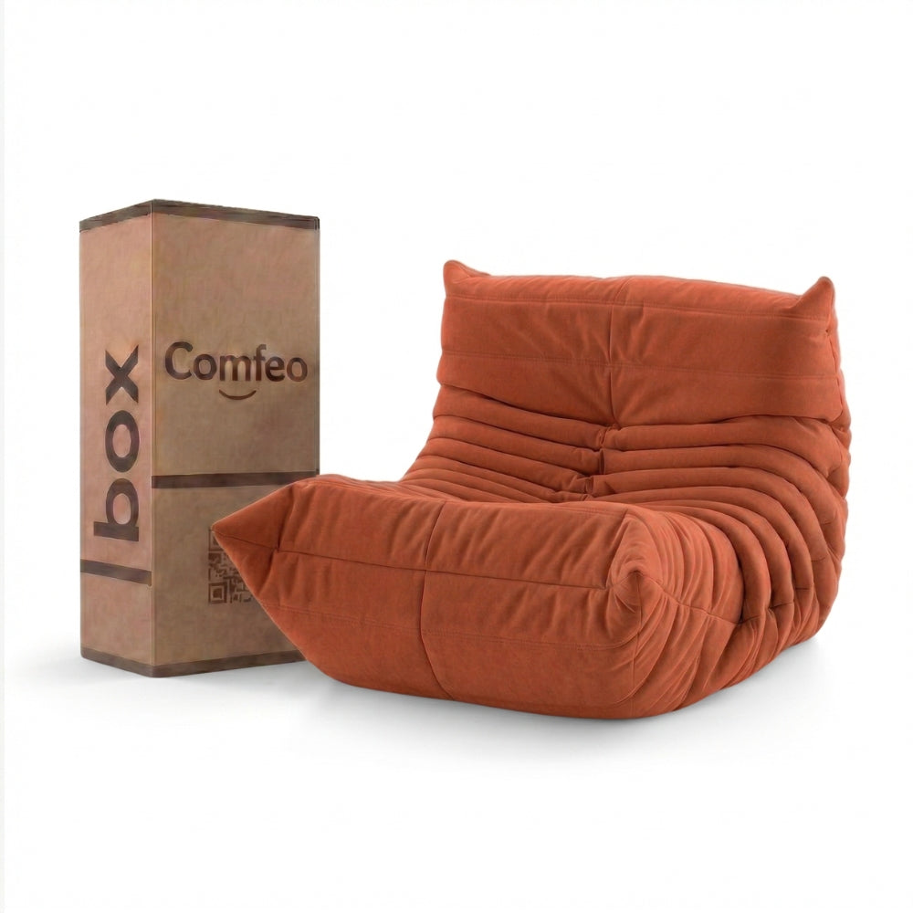 #Orange Koto Mini chauffeuse lounge compressée 1 place coloris orange, vue de face : fauteuil bas au design 70s, assise ferme, velours matelassé, livré compressé