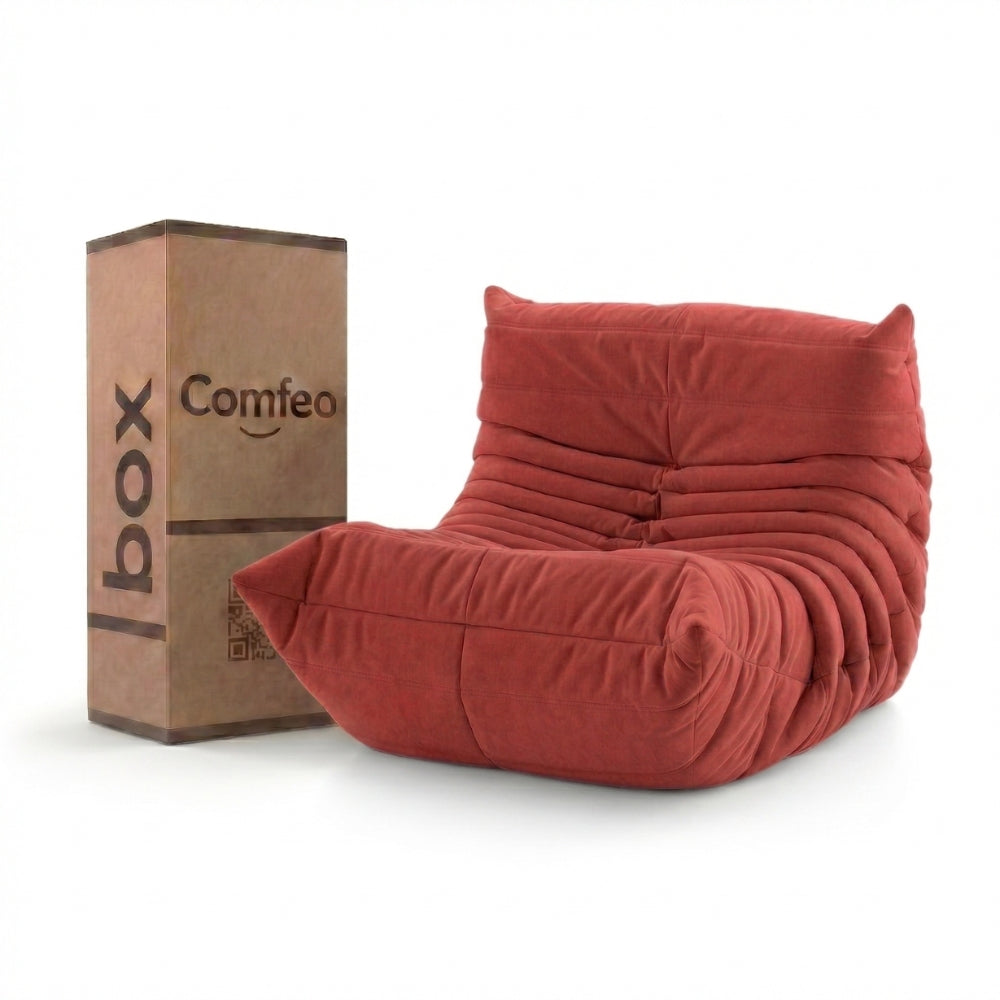 #Rouge Koto Mini chauffeuse lounge compressée 1 place coloris rouge, vue de face : fauteuil bas au design 70s, assise ferme, velours matelassé, livré compressé