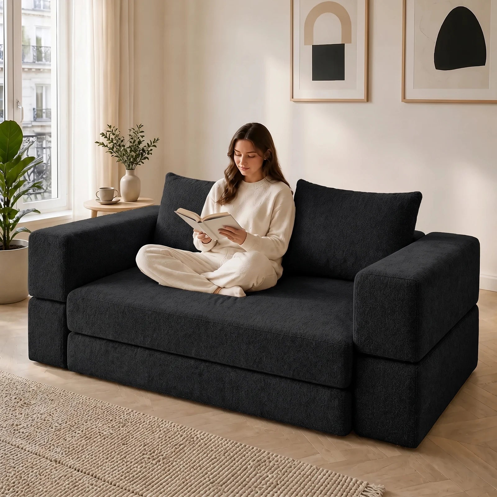 #Noir Canapé lit Nido noir en tissu chenille, installé dans un salon lumineux