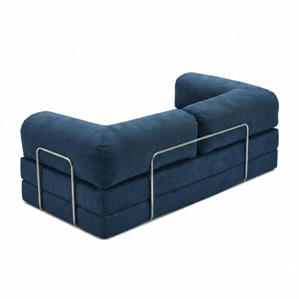 #Bleu Canapé lit Nubo bleu, vue trois quarts montrant l'armature chromée latérale et les trois couches de mousse