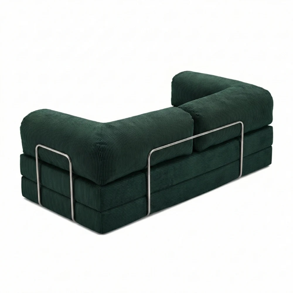 #Emeraude Canapé lit Nubo emeraude, vue trois quarts montrant l'armature chromée latérale et les trois couches de mousse