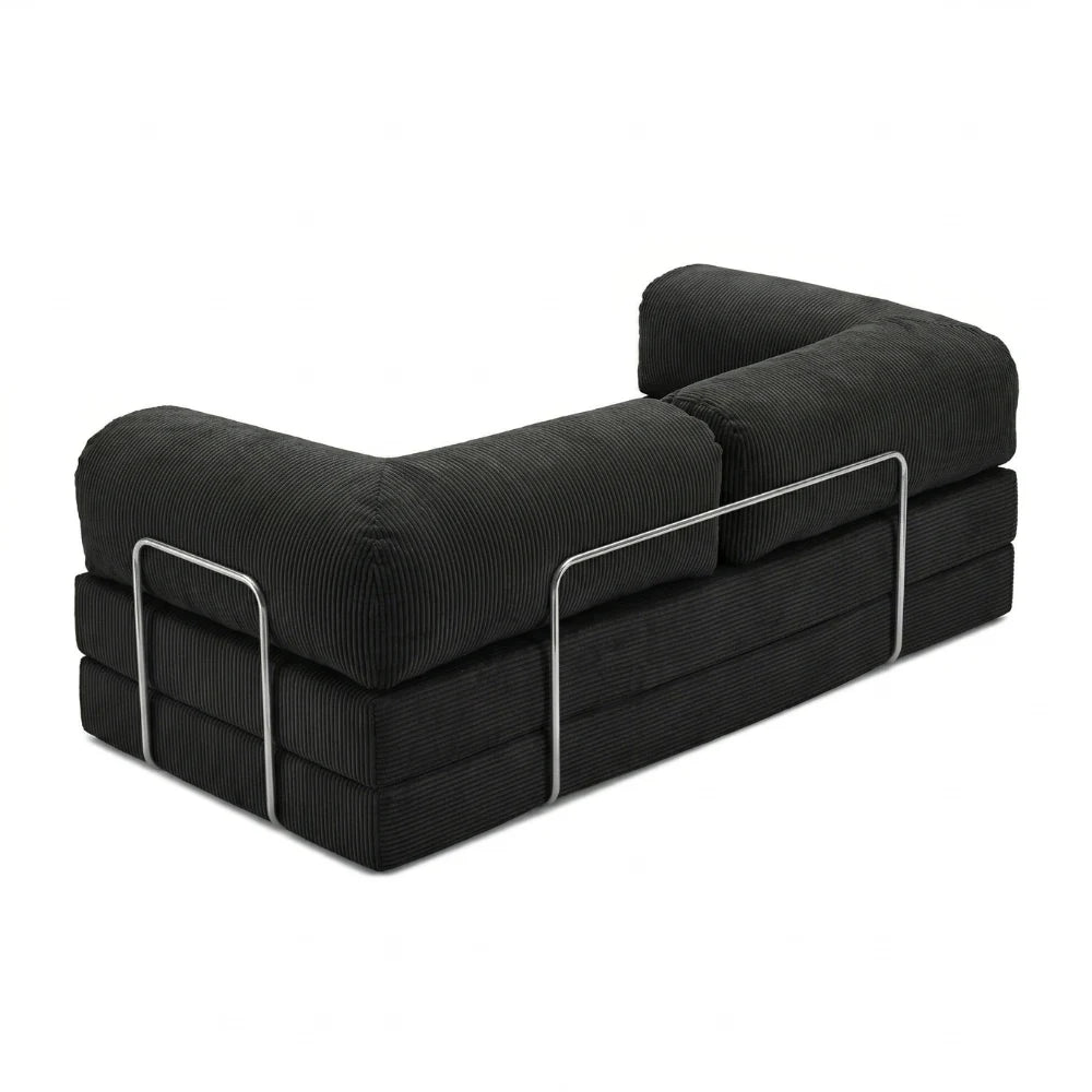 #Noir Canapé lit Nubo noir, vue trois quarts montrant l'armature chromée latérale et les trois couches de mousse