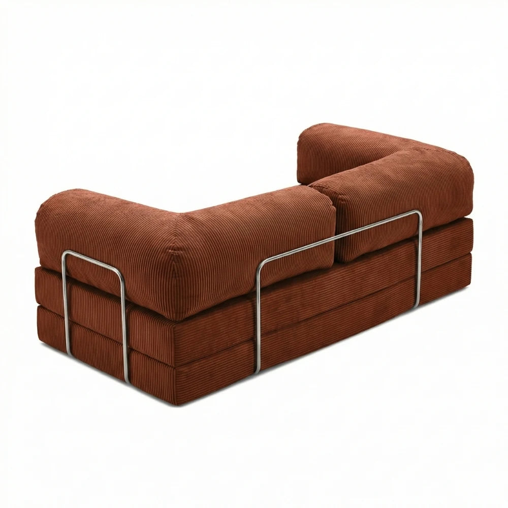 #Rouille Canapé lit Nubo rouille, vue trois quarts montrant l'armature chromée latérale et les trois couches de mousse