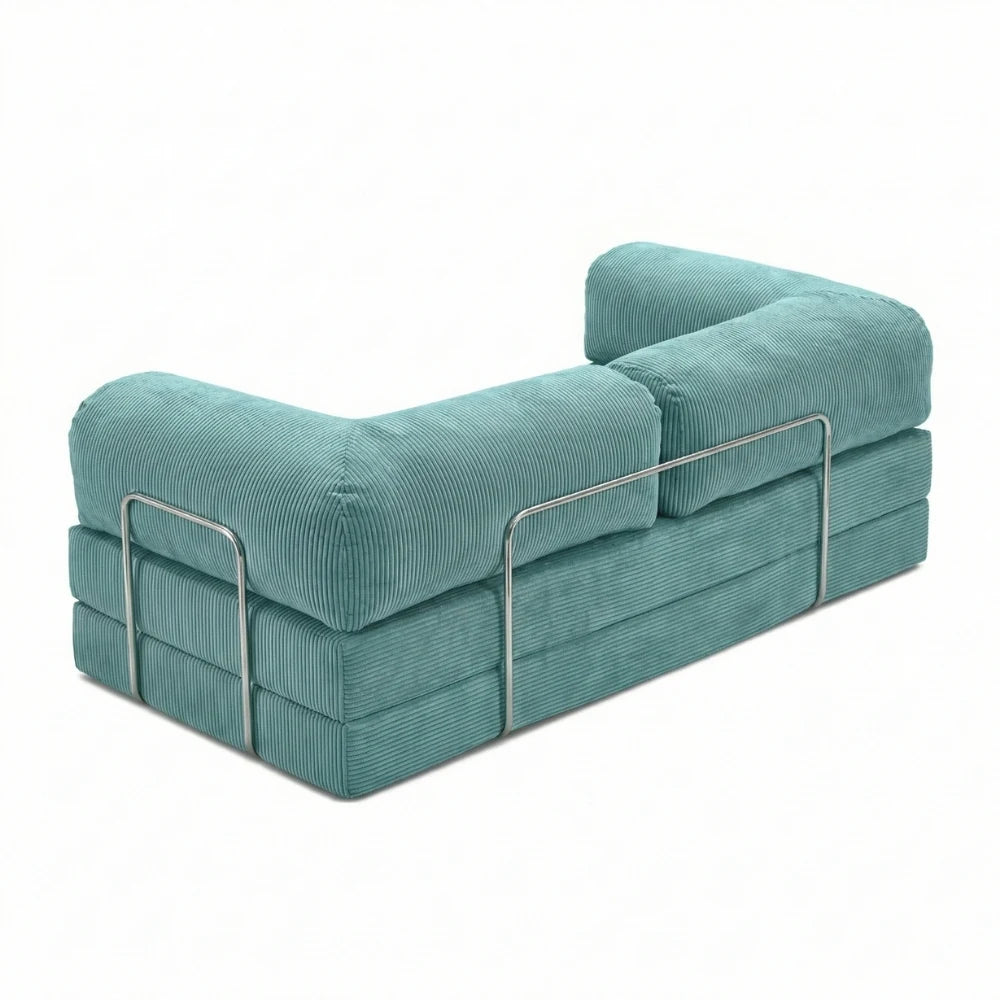 #Turquoise Canapé lit Nubo turquoise, vue trois quarts montrant l'armature chromée latérale et les trois couches de mousse
